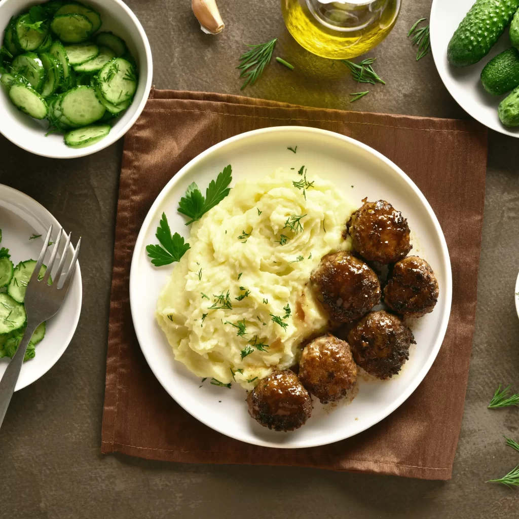 Traditional Swedish Food: Meatballs with Potatoes and Lingonberry Sauce